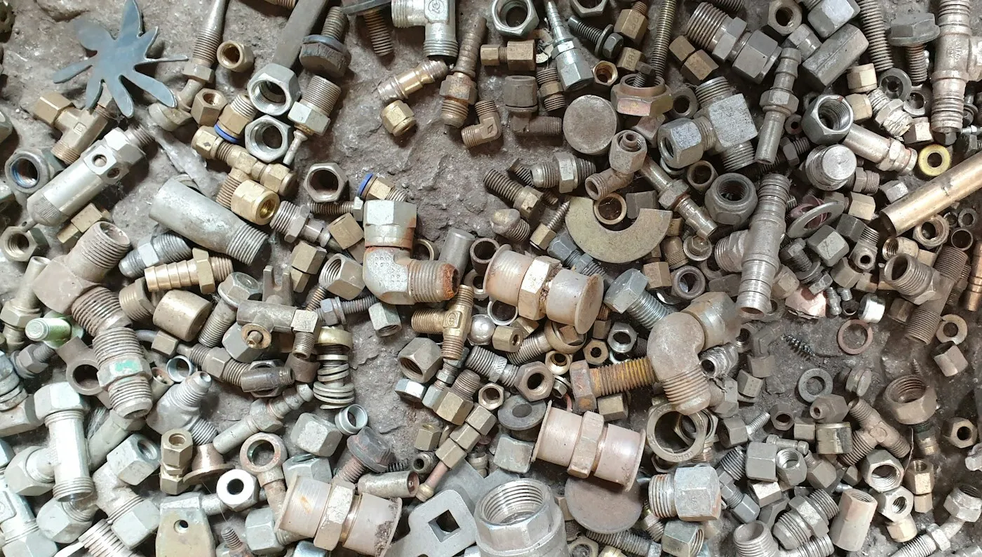 Pile of metal pipe fittings for scrap metal collection Stevenage Scrap Metal Ltd Bedfordshire